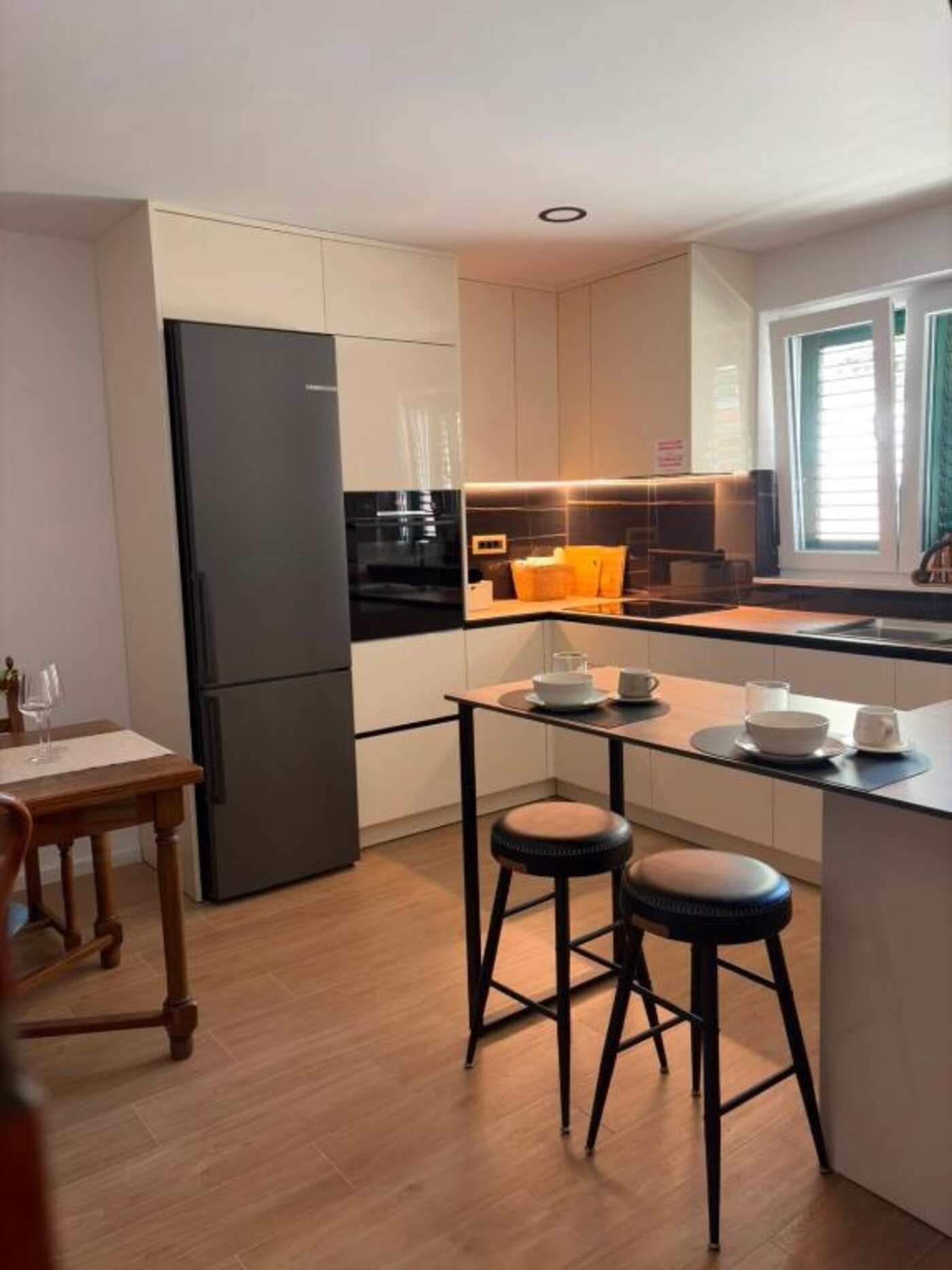 Shared kitchen with dining area for guests